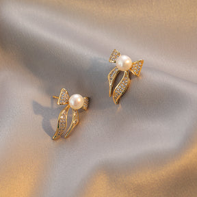 Eugenie - 18K Bejeweled Shiny Natural Pearl Bow Tie Stud Earrings