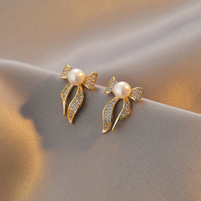 Eugenie - 18K Bejeweled Shiny Natural Pearl Bow Tie Stud Earrings